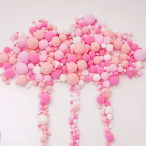 DIY creative craft kit featuring assorted pink and white elastic pom-poms in various sizes