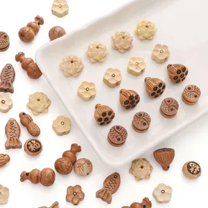 Détails de perles en bois sculptées à la main avec formes de lotus et gourde pour bricolage