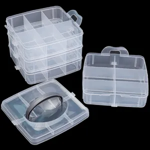 Detalle de la caja de almacenamiento de plástico transparente apilable con compartimentos fijos
