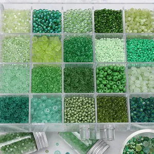 Detailed top view of 20-grid storage box with mixed green glass seed beads for DIY jewelry