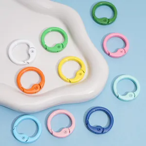 Close-up of multi-colored round alloy spring ring clasps for DIY jewelry making and keychains