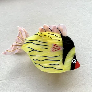 Cute tropical fish hair claw clip made of yellow acetate with colorful wave patterns