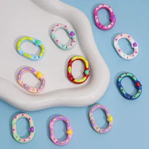 Close-up of colorful heart-shaped spring rings for DIY keychains and accessory making