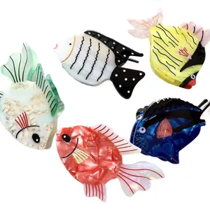 Five colorful acetate fish hair claws with shimmering pearl finish for girls