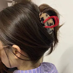 Acetate shark hair claw clip in tortoiseshell and red contrast design for women