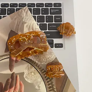 Lot de 3 pinces à cheveux en acétate ambre, formes bretzel et croissant, effet marbré