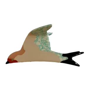 Minimalist blue swallow bird claw clip in acetic acid resin with marble wing texture