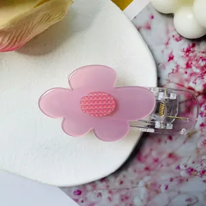 Pince à cheveux fleur rose en acétate avec strass brillants et ressort doré élégant