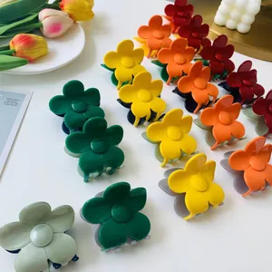 Floral claw clips in red orange yellow and green matte finish for elegant hair styling