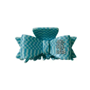 Blue and white checkerboard bow hair claw clip with rhinestones made of acetate fiber
