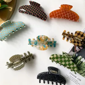 Large 9cm acetate hair claws in assorted checkered and marble patterns for thick hair