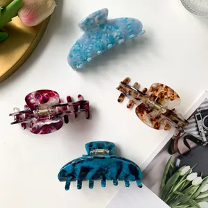 Set of four 9cm acetate marble hair claws in blue, green, burgundy, and amber colors