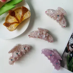 Chic acetate hair claw set featuring amber half-moon clip and floral pearl hair accessories