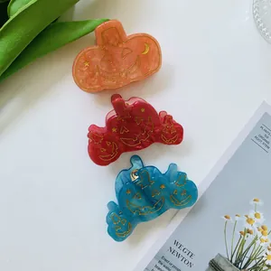 Three-piece Halloween pumpkin hair claws set in orange, red, and blue acetate finish