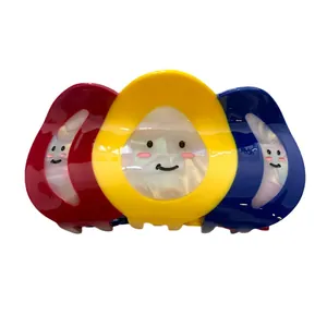 Pinza de pelo grande con contraste de tres colores y diseño de cara sonriente