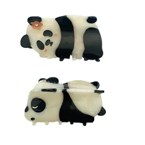 Pince à cheveux panda mignonne en acétate noir et blanc avec petit détail de fleur orange