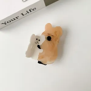 Detail view of cute acetate quokka hair claw clip showing glossy marble texture and teeth