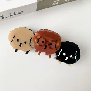 Three cute acetate dog-shaped hair claws with glasses in beige, brown and black