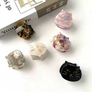 Set of 6 cute cat-shaped acetate hair claws in various colors and patterns for women