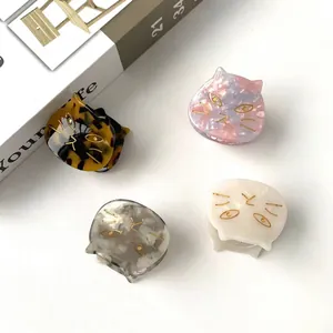 Set of four acetate cat-shaped hair claws with marble and tortoiseshell patterns