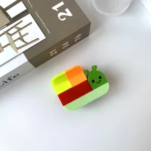 Detail of snail-shaped acetate hair claw clip featuring a colorful patchwork design