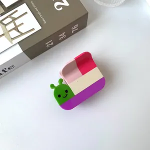 Cute snail hair claw clip with colorful patchwork design and green caterpillar charm