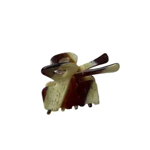 Pince à cheveux en acétate motif écaille de tortue avec design nœud élégant