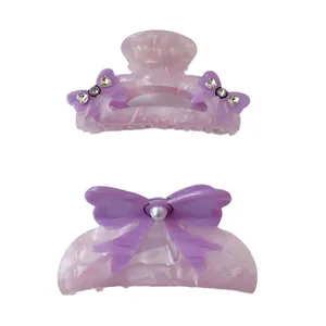 Haarklammer-Set aus Acetat in Rosa mit lila Schleifen und Perlen für süßen Lolita-Stil