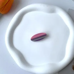 French style acetate oval hair clip with elegant pink and purple stripes on white tray