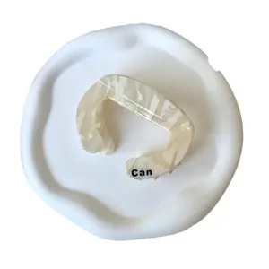 Minimalist cream marble acetate hair claw clip with black Can text on artistic tray