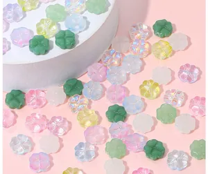 Detailed macro view of colorful glass four-leaf clover beads for DIY jewelry making