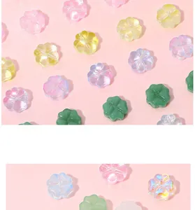 Macro shot of colorful glass four-leaf clover beads for DIY jewelry and necklaces
