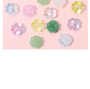 Macro view of colorful translucent glass clover beads for DIY jewelry and crafts