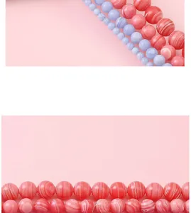 Close-up of pink and blue rhodochrosite round beads with natural striped texture