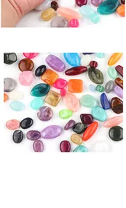 Close-up of mixed colorful acrylic beads in various shapes for DIY jewelry making
