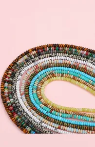 Macro shot of colorful flat round natural gemstone spacer beads for DIY jewelry making