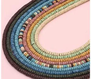 Macro shot of colorful flat round lava stone beads showing natural porous textures