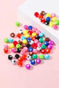 Detailed macro of colorful acrylic beads with star patterns for DIY jewelry making