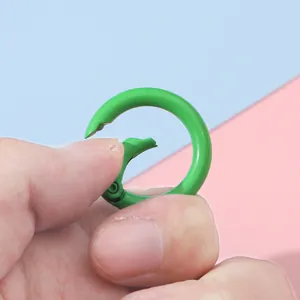25mm lime green spring ring buckle for DIY keychains and bag accessories being pressed