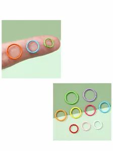 Detailed macro view of colorful baked paint metal jump rings for DIY jewelry making