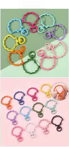 Detailed macro view of colorful shell shaped metal lobster clasps for DIY accessories