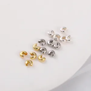 Detailed view of 14K gold filled and silver crimp covers for DIY jewelry making