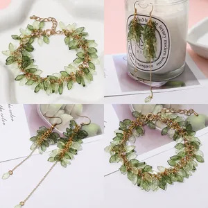Forest-style acrylic leaf charm jewelry set with golden chain bracelet and drop earrings