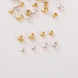 Macro view of 14K gold filled and silver crimp bead covers for DIY jewelry making