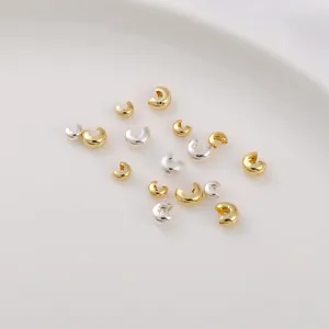 Macro view of 14K gold filled and silver crimp bead covers for DIY jewelry making
