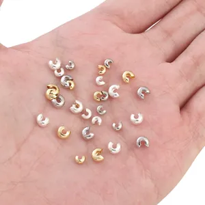 14K gold filled and silver crimp bead covers for jewelry making in hand view