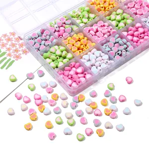 Macro detail of macaron color heart acrylic beads set with a clear storage box