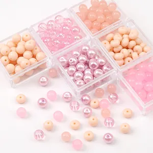 Pink and clear crystal bead set for DIY jewelry making in clear storage boxes