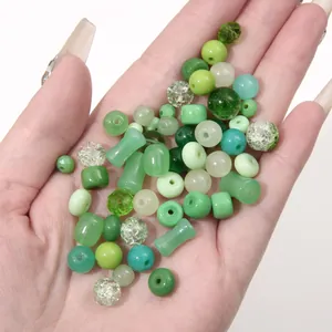 Macro detail of mixed green DIY beads set with transparent and frosted textures