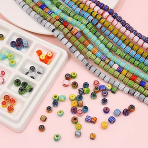 Macro detail of multicolored 6-8mm millefiori glass beads with star flower patterns